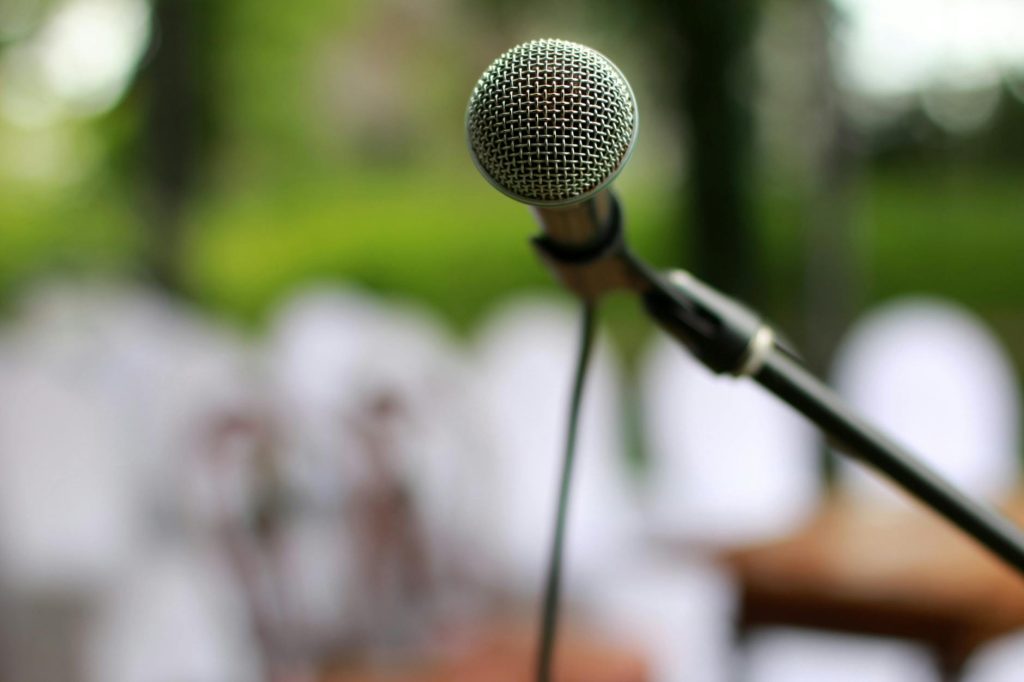 selective focus photography of microphone