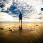 person standing on sand