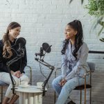 multiethnic women talking in broadcasting studio